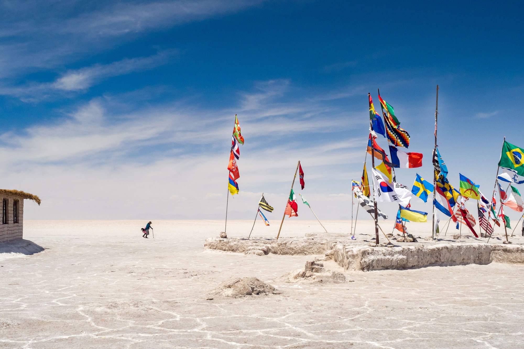 Colorful flags from all over the world at Uyuni salt flats in Bolivia, South America